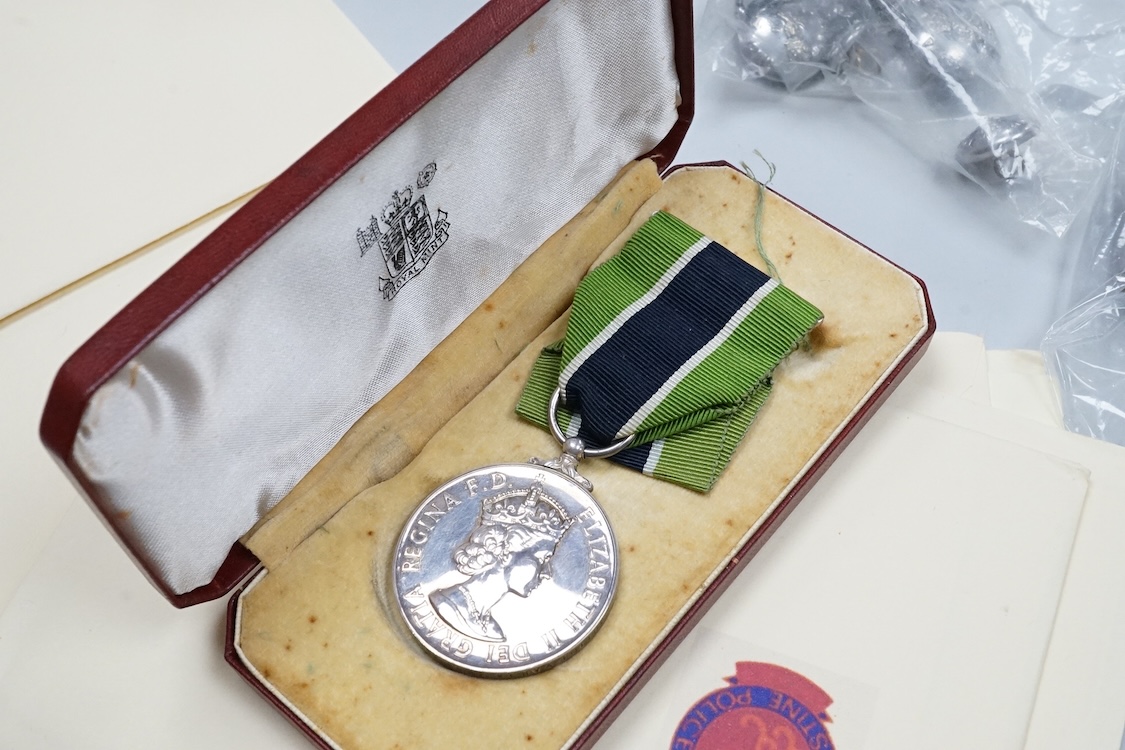 A cased ERII Colonial Police Force Medal for Meritorious Service awarded to John F. Brown, Asst. Supt. Kenya Police., together with a WWII miniature medal set including a General Service Medal with a clasp for Palestine